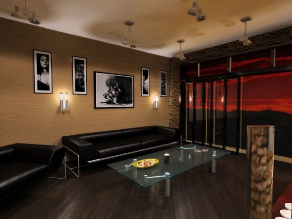 Чорний шкіряний диван в сучасній вітальні в заміському будинку Чорний шкіряний диван в сучасній вітальні в заміському будинку