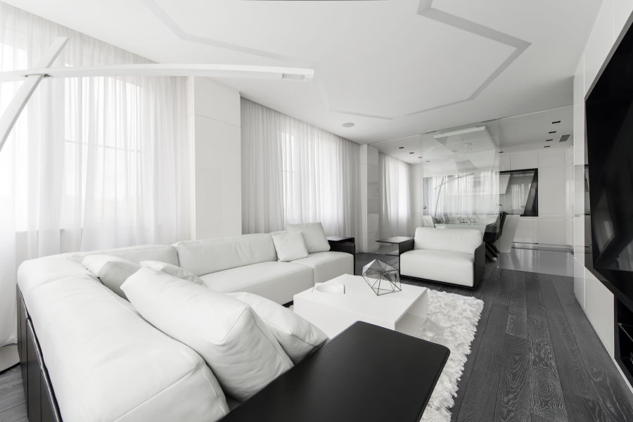 Кутовий диван білого кольору в стилі хай-тек